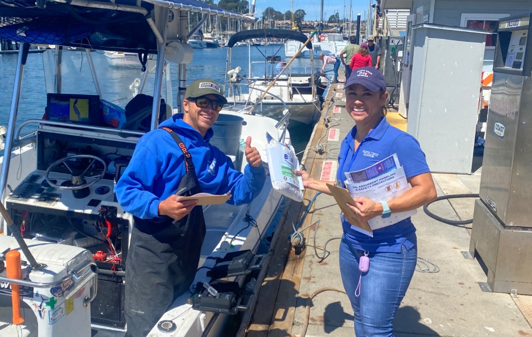 Dockwalker volunteer engaging a boater